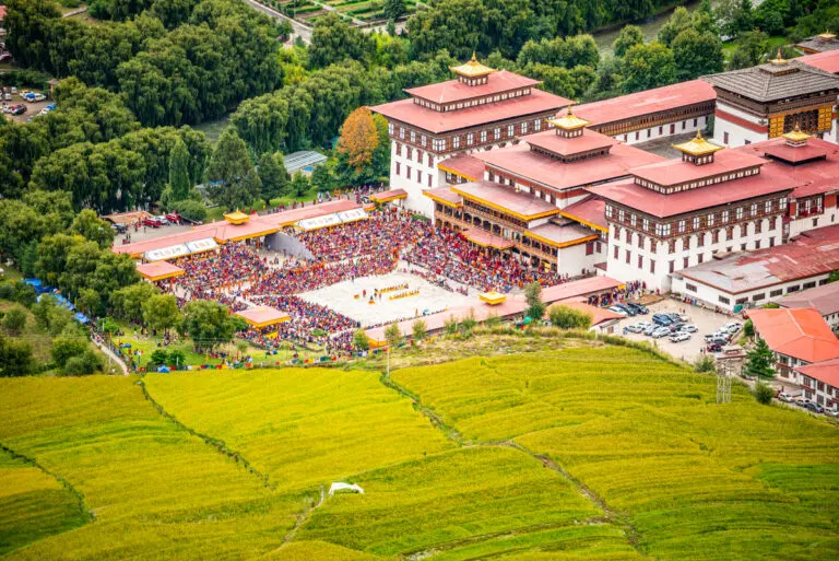 Tashichho Dzong in Thimphu surrounded by rice fields